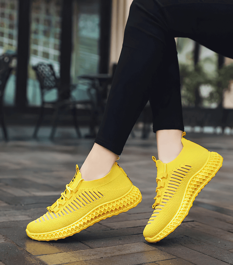 Bright yellow mesh breathable sneakers for women, casual lace-up design, perfect for walking and everyday comfort.